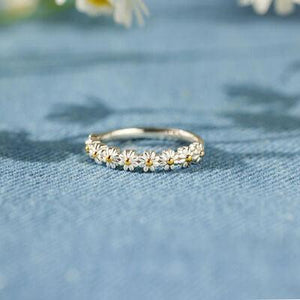 a close up of a ring on a blue cloth