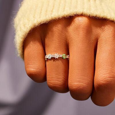 a woman's hand with a ring on it