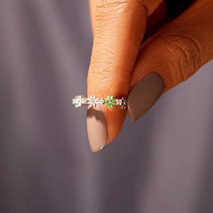 a woman's hand with a ring on her finger