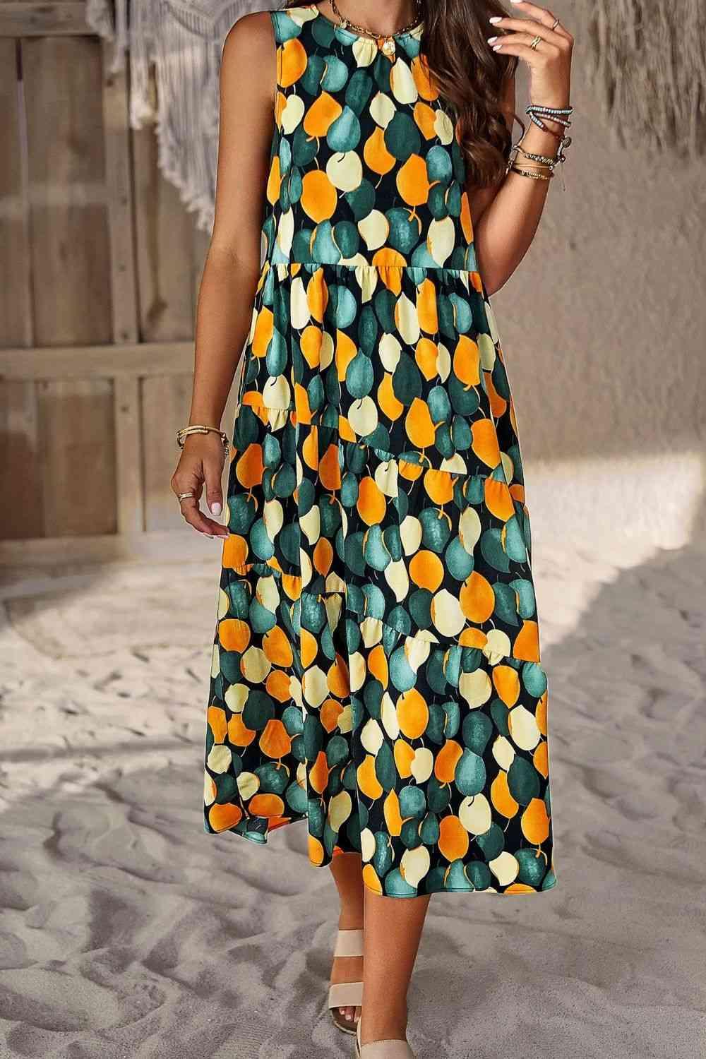 a woman wearing a dress with oranges on it