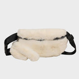 a white fur fanny bag with a black strap