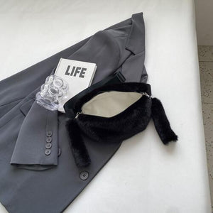 a suit and tie laying on top of a bed