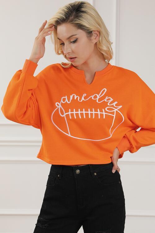 a woman wearing an orange sweatshirt that says gameday