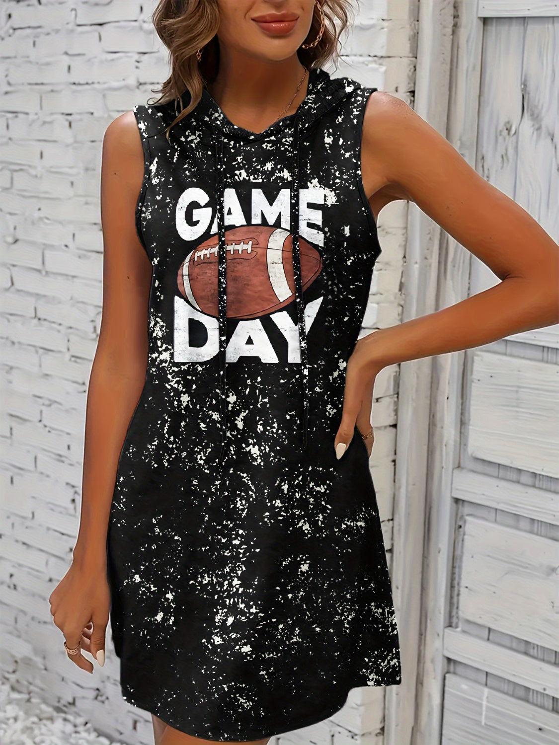 a woman wearing a black dress with a football game day on it