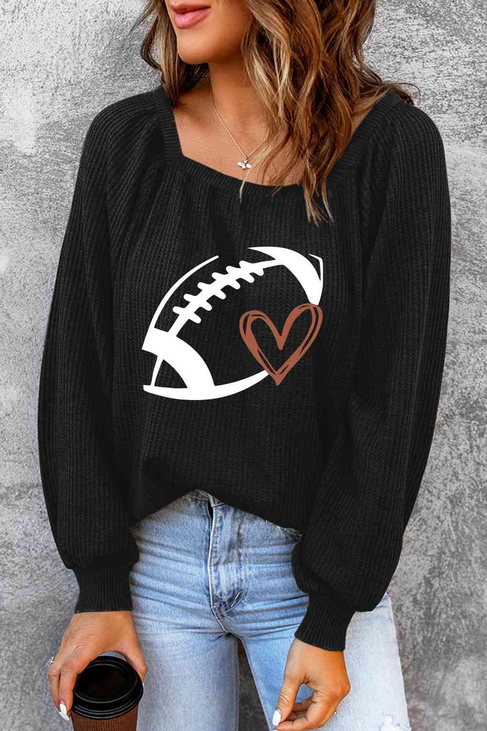 a woman wearing a black sweater with a football on it