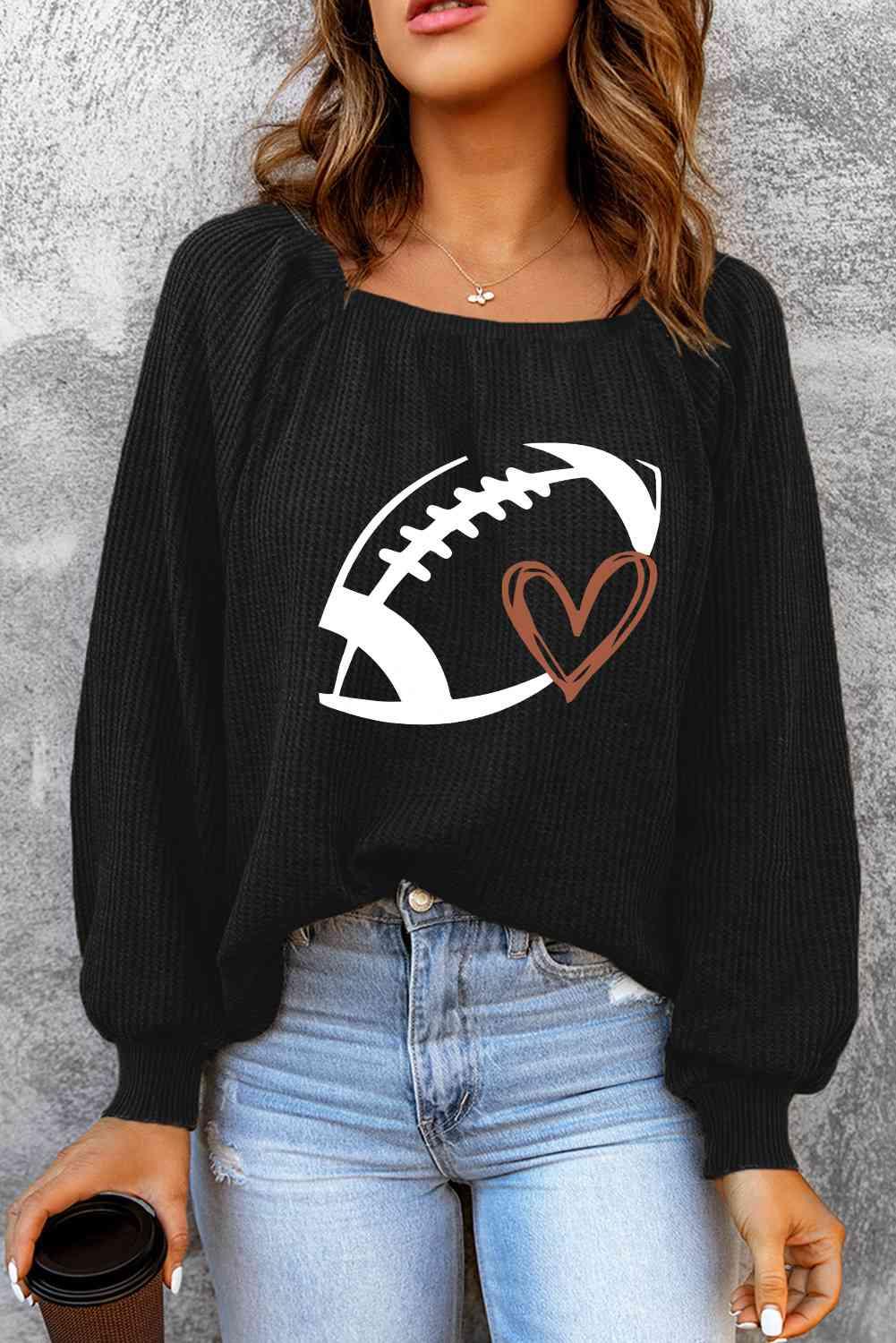a woman wearing a black sweater with a football on it