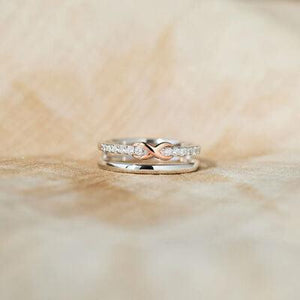 a couple of rings sitting on top of a wooden table