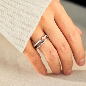 a woman's hand with a ring on it