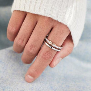 a close up of a person wearing a ring