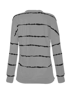 a women's sweater with black and white stripes