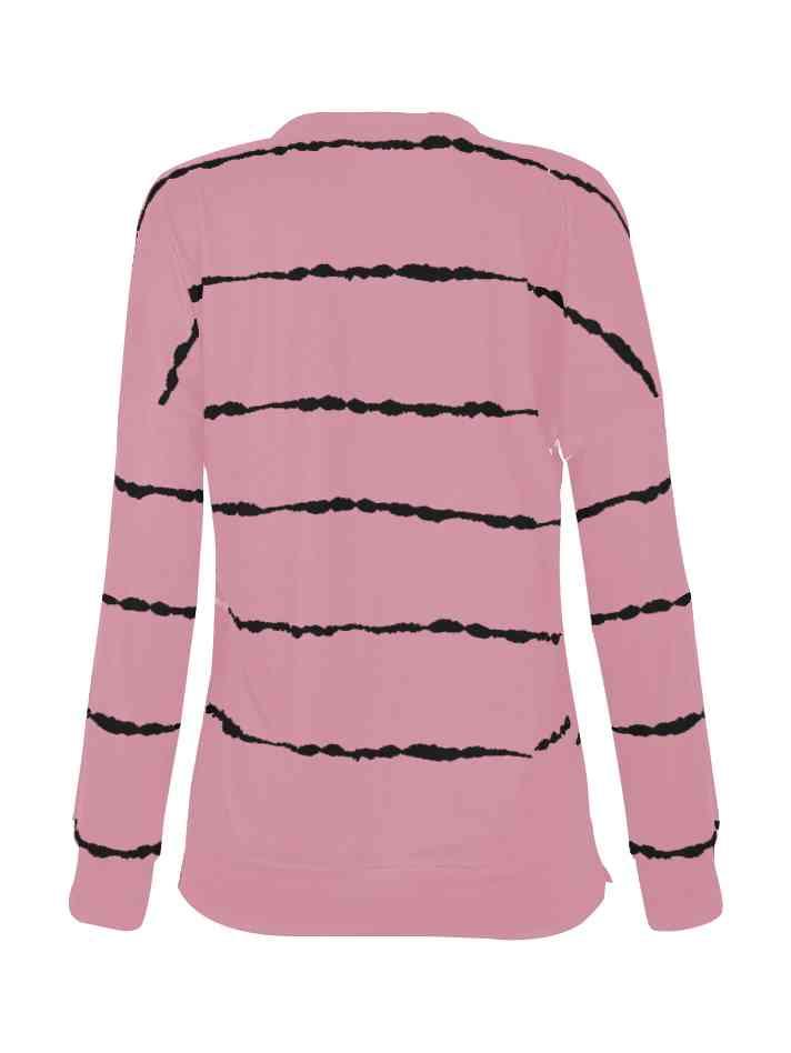 a pink shirt with black stripes on it