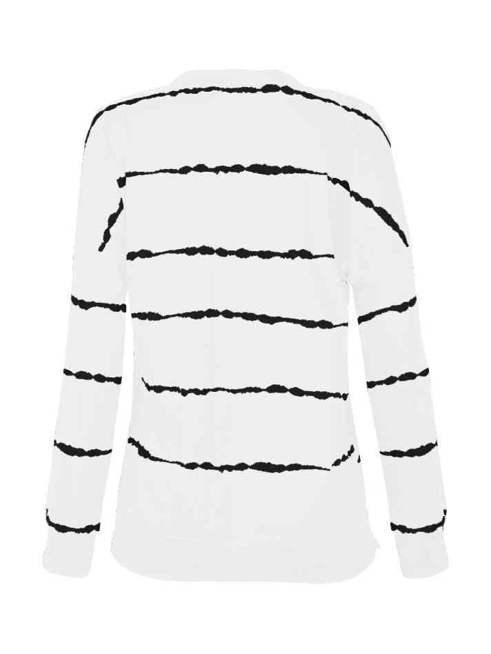 a white shirt with black stripes on it