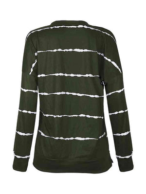 a women's green jacket with white stripes