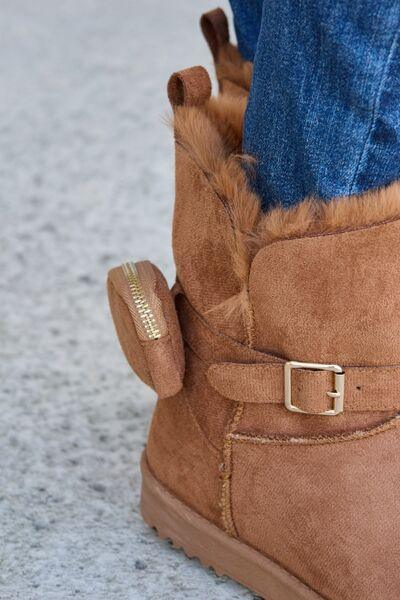 a close up of a person wearing a pair of boots