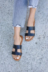 a close up of a person wearing sandals