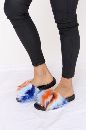 a person wearing a pair of colorful slippers
