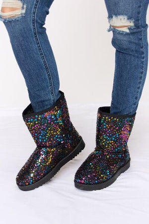 a pair of women's boots with colorful sequins