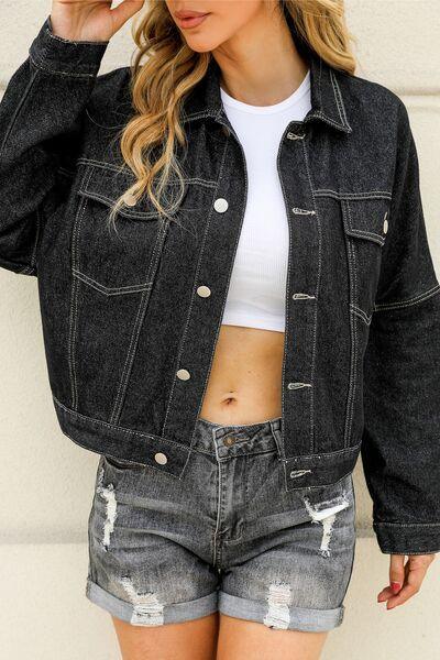 a woman wearing a denim jacket and shorts