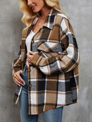 a woman wearing a brown and black plaid coat