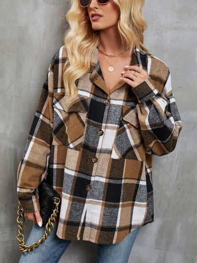 a woman wearing a brown and black plaid jacket