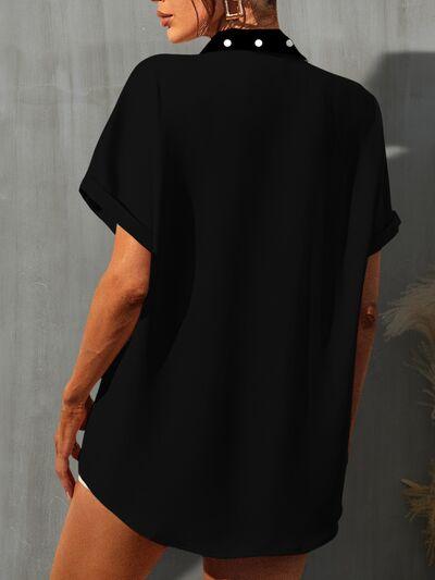 a woman wearing a black shirt and shorts