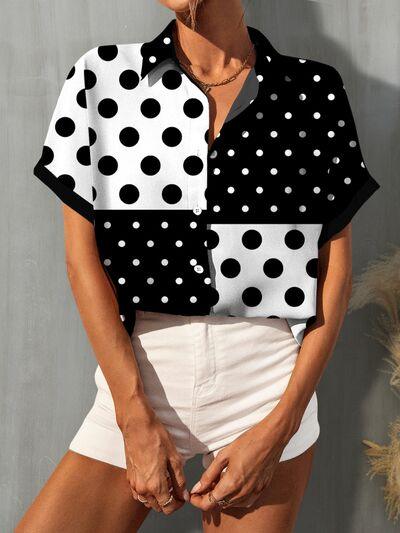 a woman wearing a black and white polka dot shirt