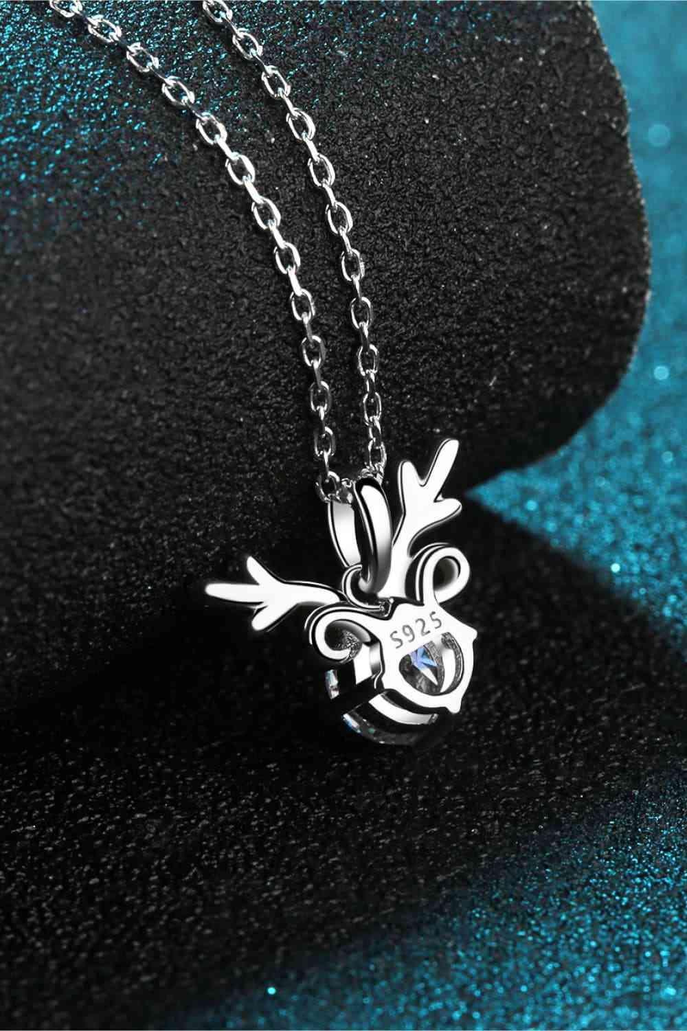 a necklace with a heart and a cross on it