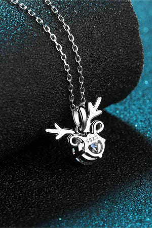 a necklace with a heart and a cross on it