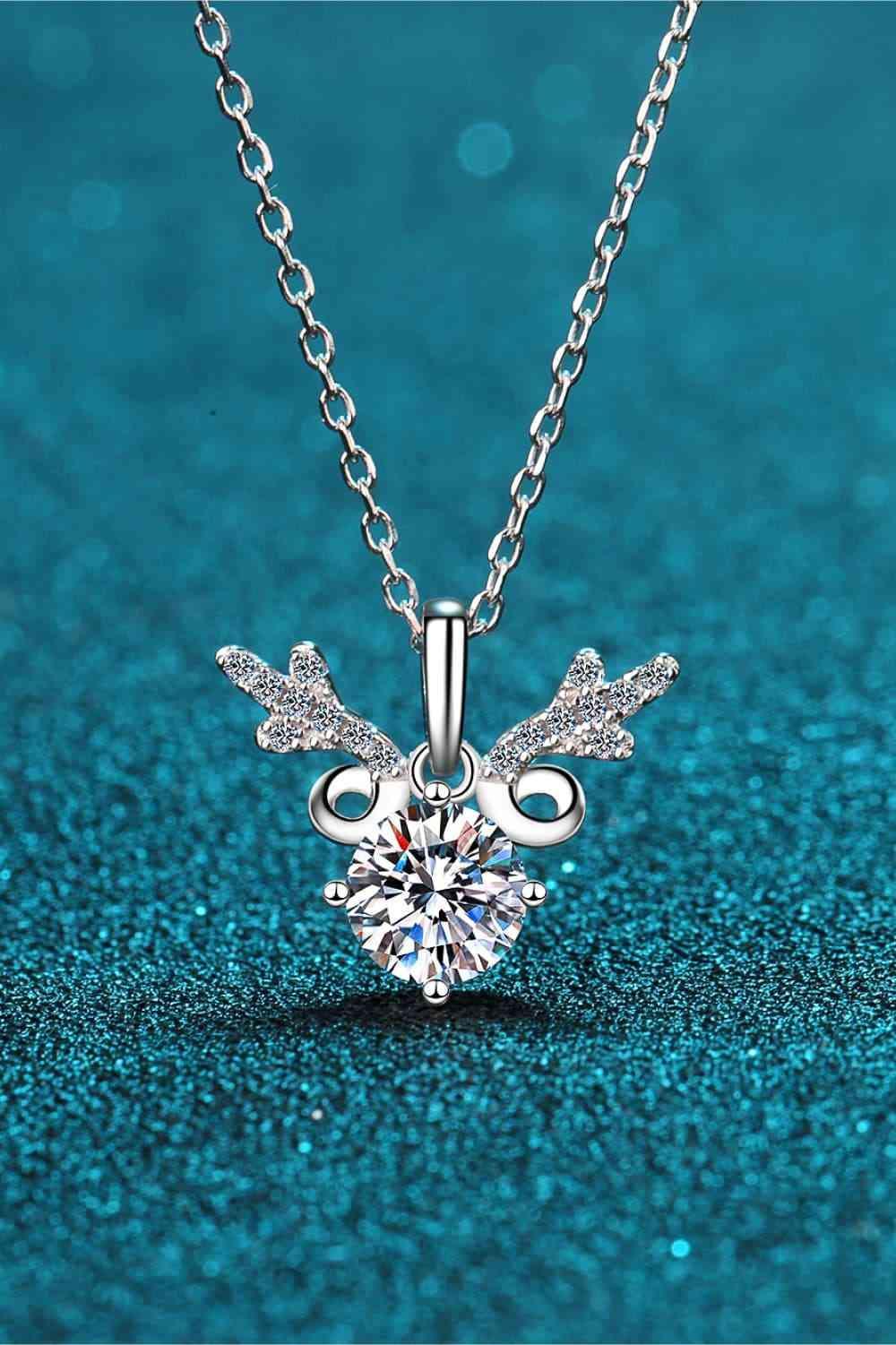 a necklace with a heart shaped diamond on a chain