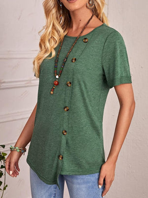 a woman wearing a green top with buttons