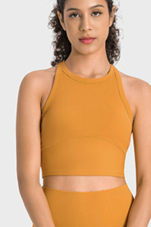 a woman in a yellow sports bra top