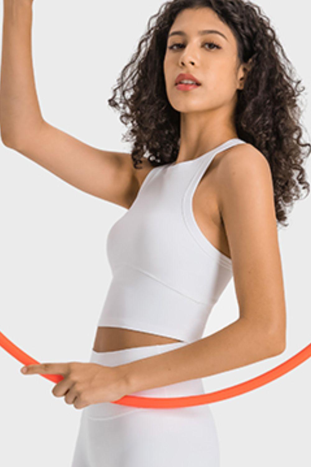 a woman is holding a hula hoop