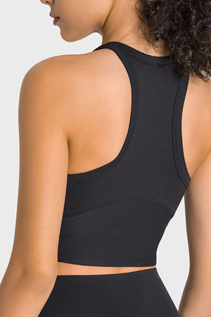 the back of a woman wearing a black sports bra