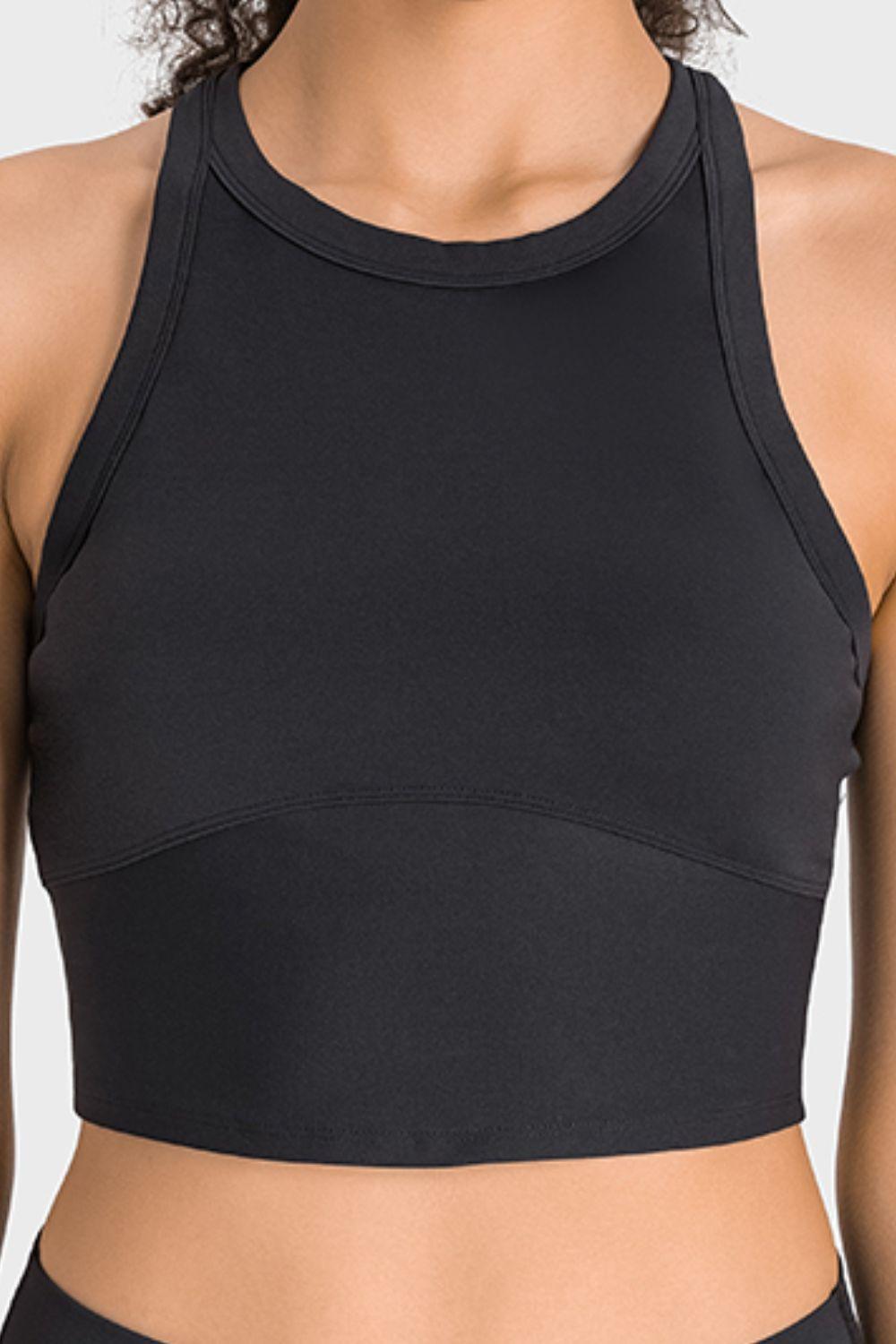 a woman wearing a black sports bra top