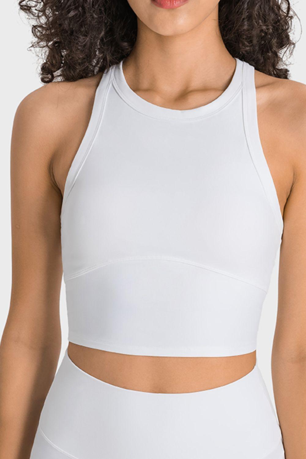 a woman wearing a white sports bra top