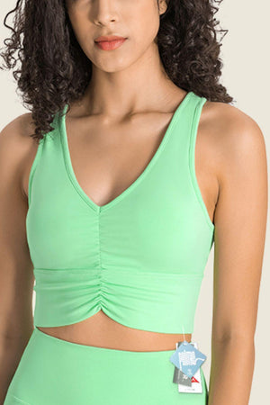 a woman in a green sports bra top