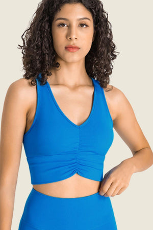 a woman in a blue sports bra top