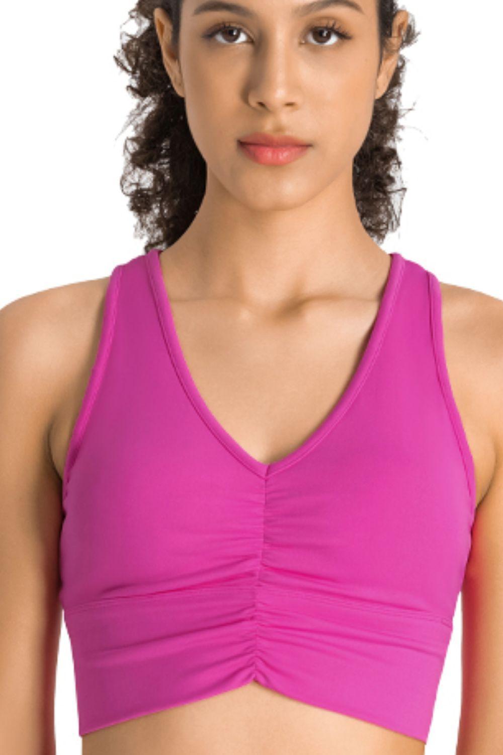 a woman in a pink sports bra top