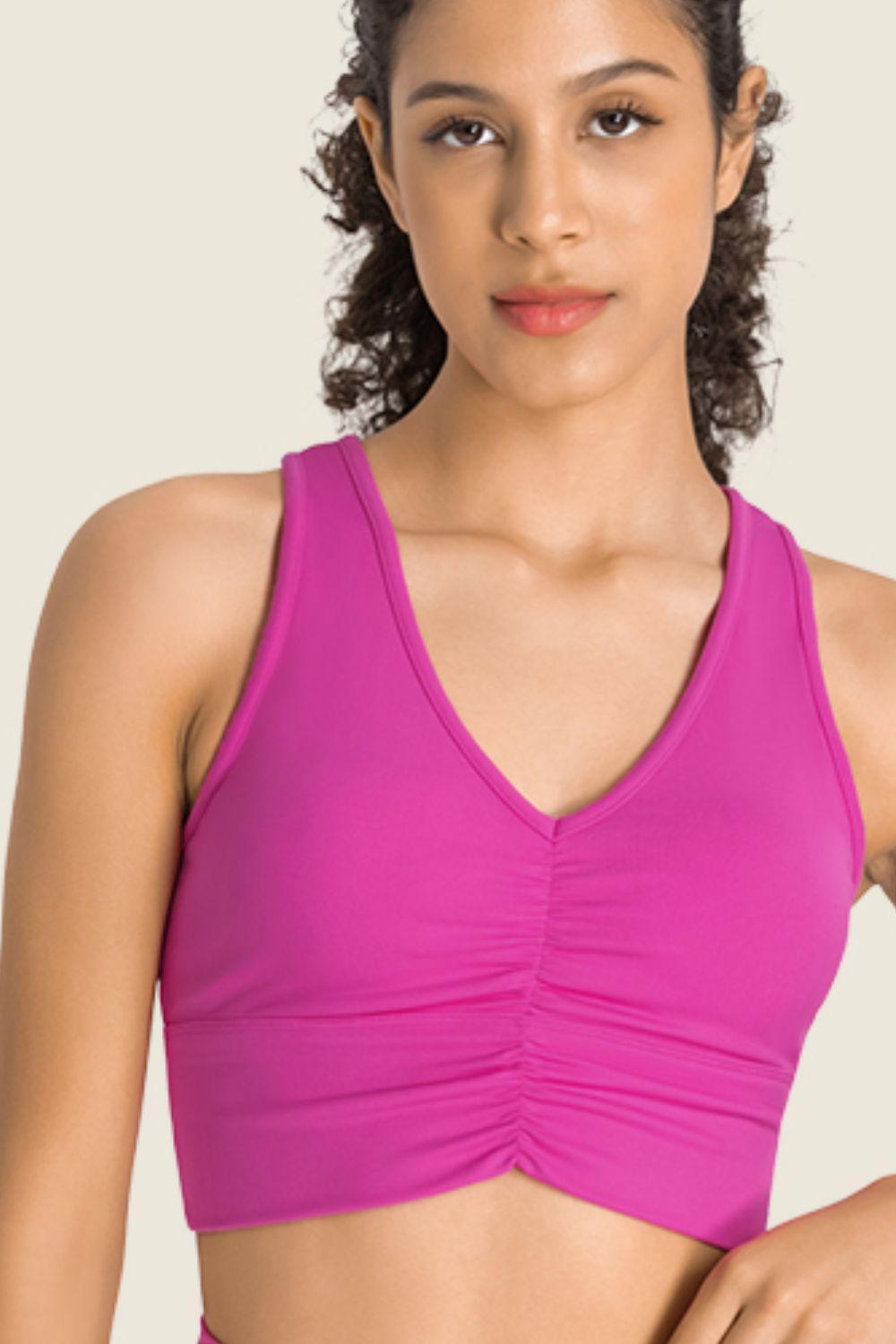 a woman in a pink sports bra top