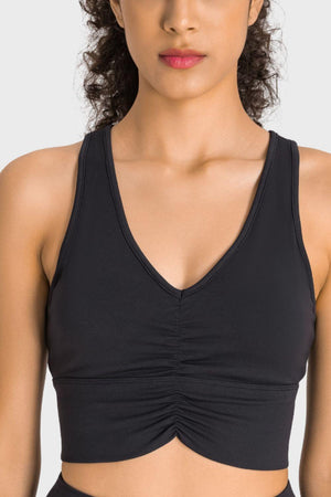 a woman wearing a black sports bra top