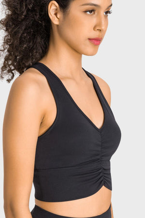 a woman wearing a black sports bra top