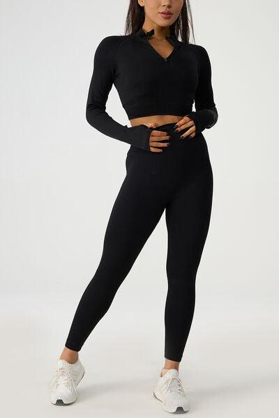 a woman in a black top and leggings