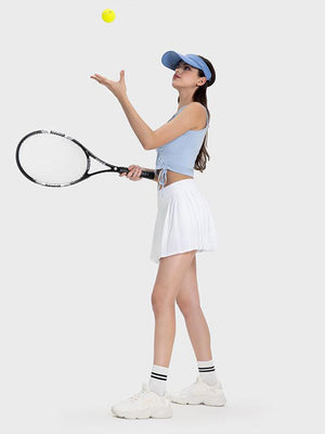 a woman holding a tennis racquet and a tennis ball