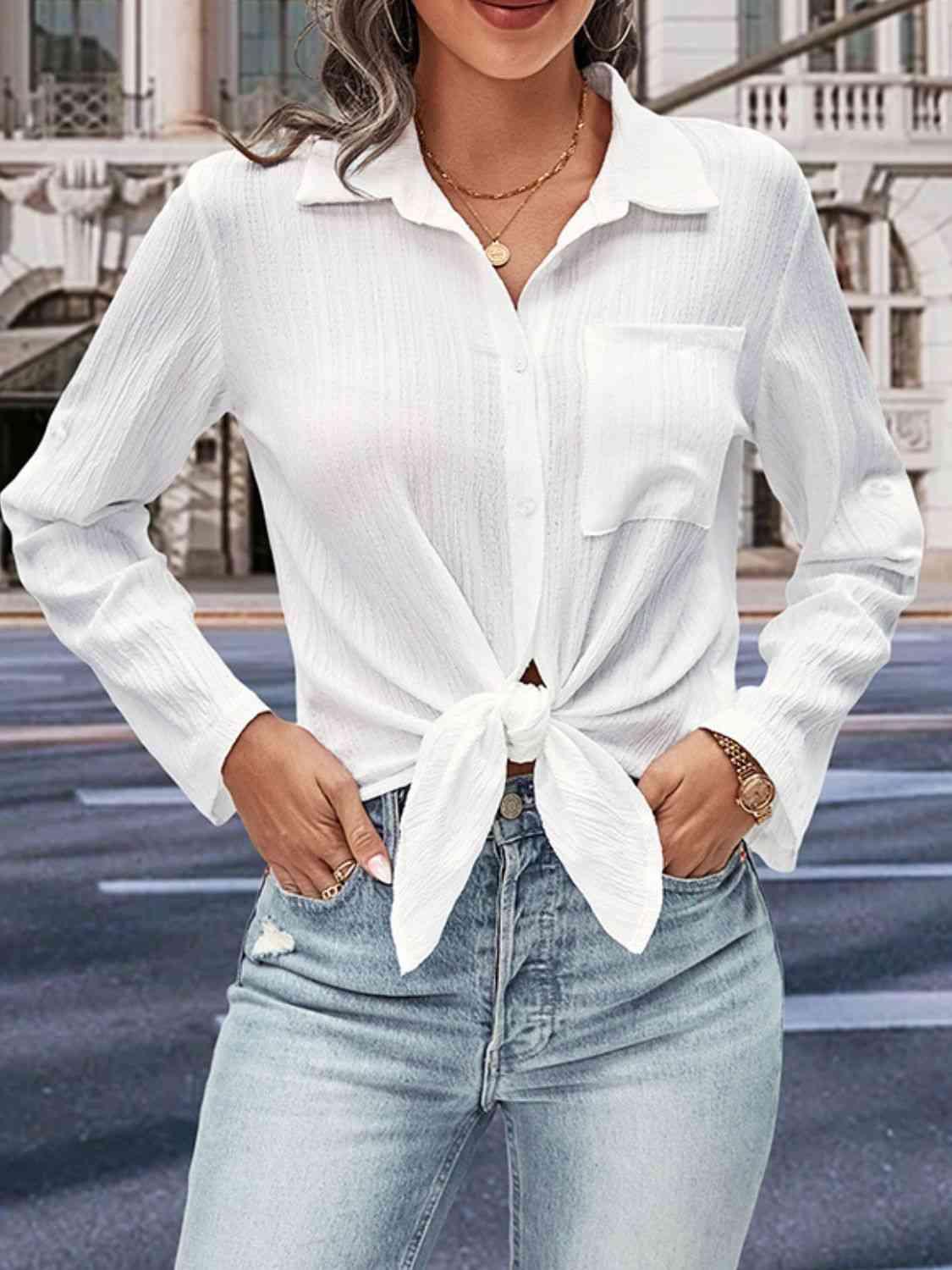 a woman wearing a white shirt and jeans