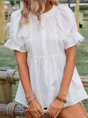 a woman in a white dress holding a basket