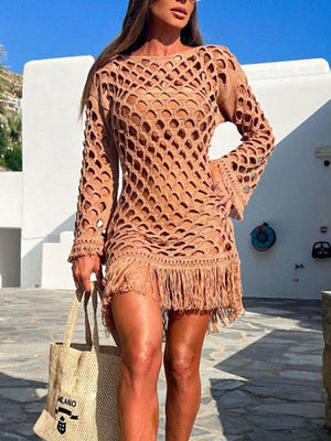 a woman in a brown dress and straw bag