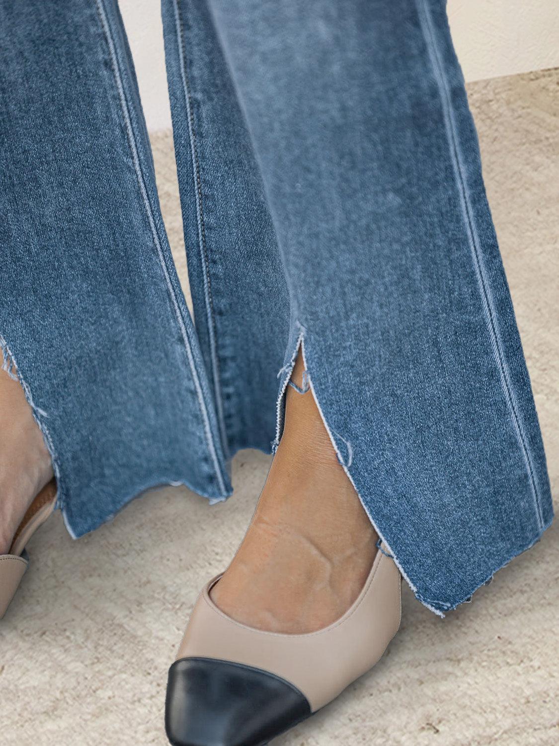 a woman in high heels is sitting on the floor