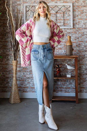 a woman standing in front of a brick wall