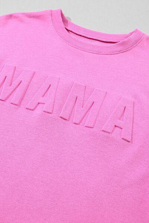 a pink shirt with the word amama printed on it
