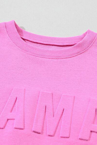 a pink shirt with the word am on it